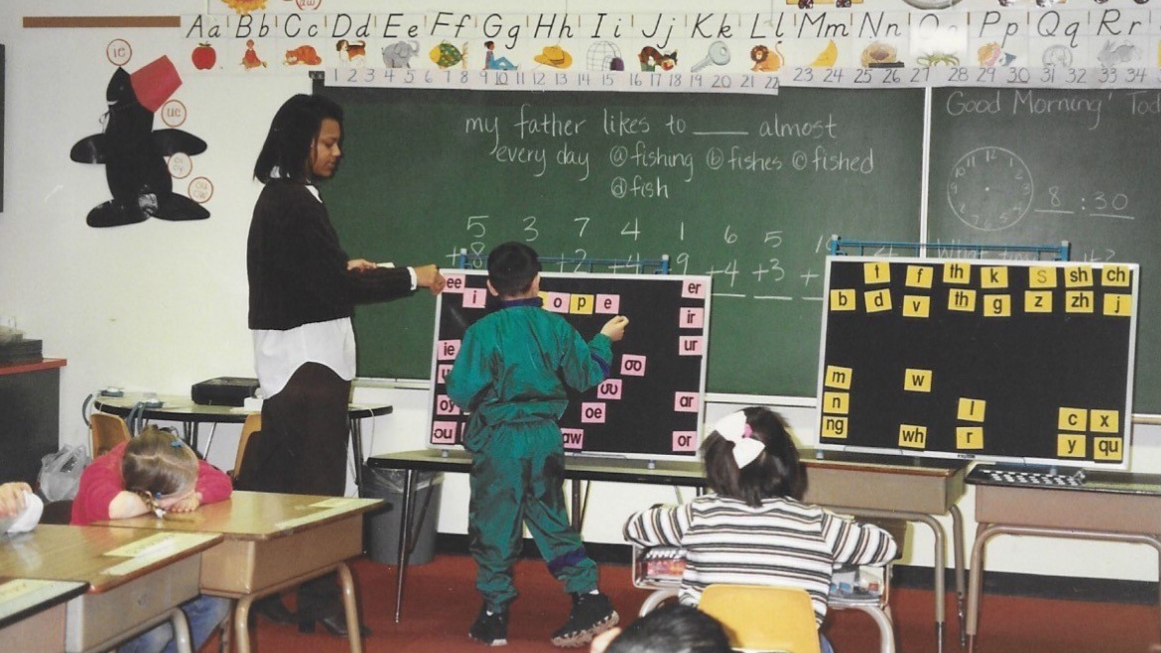 Sherelle Foust teaching a student in a classroom. 